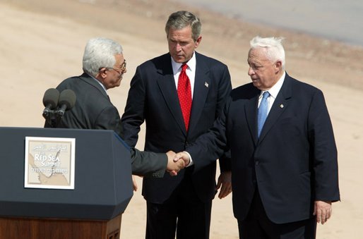 Palestinian Prime Minister Mahmoud Abbas, President George W. Bush and Israeli Prime Minister Ariel Sharon after reading statement to the press during the closing moments of the Red Sea Summit in Aqaba, Jordan Jun 4, 2003. White House photo by Paul Morse
