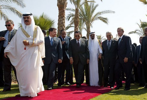 President George W. Bush walks with Red Sea Summit participants from left, King Hamad Bin Issa Al Khalifa of Bahrain, King Abdullah Bin Al Hussein of Jordan, President Hosni Mubarak of Egypt, Prince Abdullah Bin Abd Al Aziz of Saudi Arabia, and Prime Minister Mahmoud Abbas from the Palestinian Delegation prior to giving statements in Sharm El Sheikh, Egypt June 3, 2003. White House photo by Paul Morse.