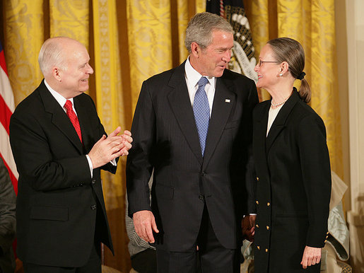 President George W. Bush congratulates C-SPAN founder Brian Lamb and his wife Victoria during the presentation of the Presidential Medal of Freedom Monday, Nov. 5, 2007, in the East Room. "For nearly 30 years, the proceedings of the House of Representatives have been televised -- unfiltered, uninterrupted, unedited, and live," said the President. "For this we can thank the Cable-Satellite Public Affairs Network, or C-SPAN. And for C-SPAN, we can thank a visionary American named Brian Lamb." White House photo by Eric Draper