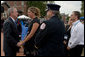 President George Bush greets and offers comfort to friends and family members of firefighters who lost their lives in the line of duty, during a ceremony at the National Fallen Firefighters Memorial in Emmitsburg, Md., Sunday, Oct. 7, 2007. White House photo by Chris Greenberg