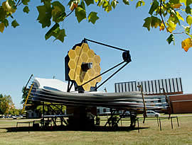 Photo of the Webb telescope on a green lawn.