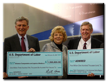 Congressman Berry (far right) presents check for ADWIRED grant at Midsouth Community College with Governor Mike Beebe and Department of Labor representative, Emily DeRocco.