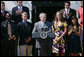 President George W. Bush is applauded as he addresses his remarks to athletes, their family members and invited guests Tuesday, June 24, 2008 at the White House, in honor of the 2007 and 2008 NCAA Sports Champions. White House photo by Luke Sharrett