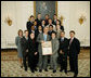 President George W. Bush stands with members of the University of Oklahoma Men's Gymnastics' team, Tuesday, June 24, 2008, during a photo opportunity with the 2007 and 2008 NCAA Sports Champions. White House photo by Eric Draper