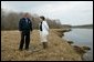 President George W. Bush on speaks with Research Director Dr. Michele Dionne during a tour of the Wells National Estuarine Research Reserve in Wells, Maine, Thursday, April 22, 2004. "Up to half of all North American bird species nest or feed in wetlands. About half of all threatened and endangered species use wetlands. There's some endangered species using the wetlands right here on this piece of property," said the President in his remarks. White House photo by Eric Draper.