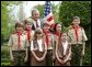 President George W. Bush congratulates the Dodge Elementary Scouts for Wetland Habitat Enhancement of East Amherst, N.Y., on receiving the President’s Environmental Youth Award in the East Garden April 22, 2004. White House photo by Susan Sterner.