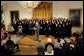 President George W. Bush speaks during the presentation of the Commander-In-Chief Trophy to the U.S. Naval Academy football team in the East Room Monday, April 19, 2004. The trophy is awarded to the Service Academy with the year's best overall record in NCAA football games versus the other academies. White House photo by Tina Hager.