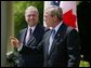 President George W. Bush and Canadian Prime Minister Paul Martin respond to questions from the press corps in the Rose Garden after a meeting at the White House on April 30, 2004.  White House photo by Paul Morse