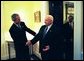 President George W. Bush welcomes Prime Minister Ariel Sharon of Israel to the White House Wednesday, April 14, 2004. The two leaders met in the residence before holding a joint press conference. Pictured behind the Prime Minister is U.S. Department of State Chief of Protocol Donald Ensenat. White House photo by Eric Draper.