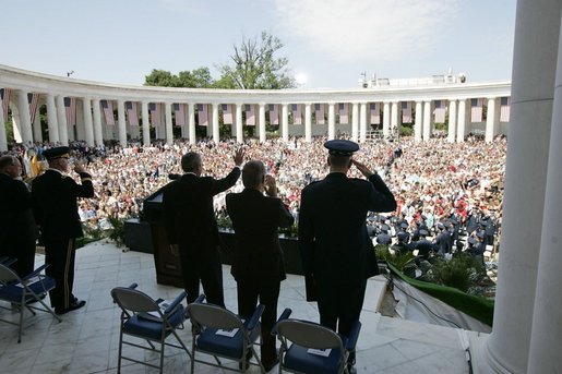 President George W. Bush, Secretary of Defense Donald Rumsfeld and Chairman of the Joint Chiefs of Staff General Richard Meyers participate in a Memorial Day ceremony at the Arlington National Cemetery amphitheatre in Arlington, Va., May 30, 2005. White House photo by Paul Morse