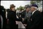 First Lady Laura Bush shakes hands with a veteran following a ceremony Sunday, May 8, 2005, in Margraten, Netherlands honoring those who served in World War II. The ceremony highlighted the President and First Lady’s visit to the Netherlands before moving on to Moscow. White House photo by Krisanne Johnson