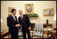 President George W. Bush talks with Prime Minister Anders Fogh Rasmussen of Denmark in the Oval Office Friday, May 20, 2005. White House photo by Eric Draper