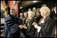 President George W. Bush greets members of the 50th anniversary class of Calvin College after giving a commencement address at Calvin College in Grand Rapids, Michigan on Saturday May 21. White House photo by Paul Morse