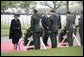 Queen Beatrix of The Netherlands and President George W. Bush pause in respect before wreaths at the Netherlands American Cemetery Sunday, May 8, 2005, in Margraten, honoring those who served during World War II. White House photo by Eric Draper