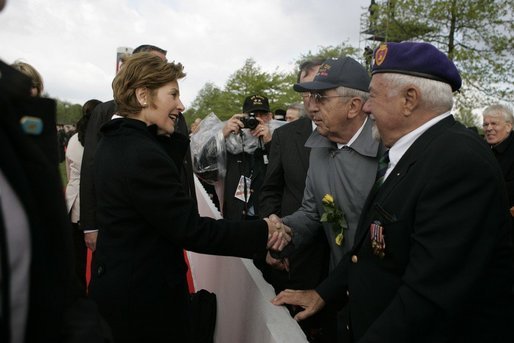 First Lady Laura Bush shakes hands with a veteran following a ceremony Sunday, May 8, 2005, in Margraten, Netherlands honoring those who served in World War II. The ceremony highlighted the President and First Lady’s visit to the Netherlands before moving on to Moscow. White House photo by Krisanne Johnson