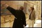 Father Michele Piccirillo, head of the Franciscan Archeology Society, gives Laura Bush a tour of the Interpretative Center at Mount Nebo in Jordan Saturday, May 21, 2005. Mount Nebo is the holy site where Moses is believed to have died. White House photo by Krisanne Johnson