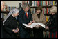 President George W. Bush and Mrs. Laura Bush visit the "book nook" at the Little Sisters of the Poor Tuesday, Dec. 18, 2007, in Washington, D.C. With them are, from left: Archbishop Donald Wuerl of the Archdiocese of Washington, Mother Benedict de la Passion, Superior and President of Little Sisters of the Poor, and Mary Ann Lucey, volunteer librarian. White House photo by Chris Greenberg