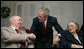 President George W. Bush pauses with residents of the Little Sisters of the Poor Tuesday, Dec. 18, 2007, in Washington, D.C. The Congregation of the Little Sisters of the Poor was founded in France in 1839, and today, Little Sisters care for the aged poor in 31 countries around the world. White House photo by Chris Greenberg