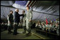 Vice President Dick Cheney awards SSgt Vincent Lewis with the Combat Infantry Badge during a rally for the troops Thursday, May 10, 2007 at Contingency Operating Base Speicher, Iraq. White House photo by David Bohrer