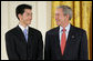 President George W. Bush welcomes Jonathan Wu of Fremont, Calif., to the stage in the East Room of the White House, where he received the President’s Volunteer Service Award Thursday, May 10, 2007, in celebration of Asian Pacific American Heritage Month. White House photo by Eric Draper