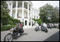 President George W. Bush bids farewell to members of the Rolling Thunder motorcycle organization, as they drive away from the South Portico of the White House following their visit Sunday, May 27, 2007. Rolling Thunder, founded by a group of Vietnam veterans in 1987, marks its 20th year of supporting U.S. troops overseas, at home and missing in action. White House photo by Joyce Boghosian