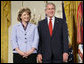 President George W. Bush joins military spouse Denise Rampolla of Cheyenne, Wyo., on stage in the East Room of the White House, to receive the President’s Volunteer Service Award Friday, May 11, 2007, during a commemoration of Military Spouse Day. White House photo by Eric Draper