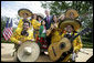 President George W. Bush poses with members of the Los Hermanos Mora Arriaga mariachi band, who performed in the Rose Garden at the White House Friday, May 4, 2007, during a celebration of Cinco de Mayo. White House photo by Eric Draper