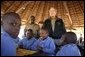 President George W. Bush talks to students attending nature classes at the Mokolodi Nature Reserve near Gaborone, Botswana Thursday, July 10, 2003. White House photo by Paul Morse.