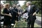 President George W. Bush shakes hands Friday, Sept. 9, 2005 with FDNY Academy graduate Tommy Gies, son of New York firefighter Lt. Ronnie Gies who died on 9/11/01, following the President's remarks at the 9/11 Heros Medal of Valor Award Cermony on the South Lawn of the White House in Washington. Gies, seen with his mother and brothers, told the President in an earlier meeting in March 2004 that it was his wish to follow in his father's footsteps. White House photo by Eric Draper