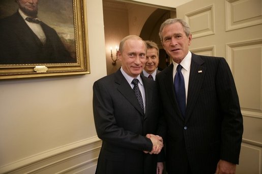 President George W. Bush welcomes Russian President Vladimir Putin into the Oval Office at the White House, Friday, Sept. 16, 2005 in Washington. White House photo by Eric Draper