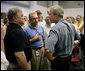 President George W. Bush talks with Mississippi Governor Haley Barbour, far left, and other state officials in Poplarville, Miss., during a visit Monday, Sept. 5, 2005 to the Gulf Coast region. White House photo by Eric Draper