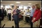 President George W. Bush addresses the press during a visit of the Red Cross in Washington, D.C. on Sunday September 4, 2005. The President and Mrs. Laura Bush visited Red Cross headquarters to view relief efforts in the aftermath of hurricane Katrina. White House photo by Paul Morse