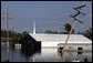 A church in New Orleans, Louisiana is submerged by floodwaters that were caused by the effects of Hurricane Katrina Thursday, September 8, 2005. The hurricane hit both Louisiana and Mississippi on August 29th. White House photo by David Bohrer