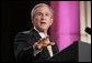 President George W. Bush gestures as he addresses an audience, Wednesday, Sept. 21, 2005 at the Republican Jewish Coalition's 20th Anniversary Celebration in Washington. White House photo by Paul Morse