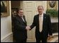 President George W. Bush welcomes Hajim al-Hasani, the Speaker of Iraq's Transitional National Assembly, into the Oval Office, Wednesday, Sept. 21, 2005 at the White House in Washington. White House photo by Paul Morse