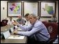 President George W. Bush speaks during a meeting with Texas officials, including Texas Governor Rick Perry, left, inside the Texas Emergency Operations Center in Austin, Texas, Saturday, Sept. 24, 2005. White House photo by Eric Draper