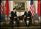 President George W. Bush and President Hu Jintao of China greet each other at the start of their meeting, Tuesday, Sept. 13, 2005, in New York. White House photo by Eric Draper