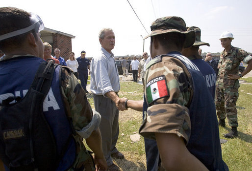 President George W. Bush greets aid workers from Mexico helping in the hurricane ravaged areas in Gulfport, Miss., Monday, Sept. 12, 2005. White House photo by Paul Morse