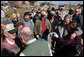 President George W. Bush puts his arm around a woman as he meets residents of Lafayette, Tennessee, Friday, Feb. 8, 2008, during his visit to assess the damage and offer comfort to those impacted by Tuesday's deadly tornadoes. White House photo by Chris Greenberg