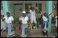 Four women cheer and wave flags upon the arrival President George W. Bush and Mrs. Laura Bush Sunday, Feb. 17, 2008, to the Amana District Hospital in Dar es Salaam, Tanzania, where President Bush and Mrs. Bush visited a patients and staff at the hospital's care and treament clinic. White House photo by Shealah Craighead