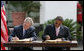 President George W. Bush and President Jakaya Kilwete of Tanzania sign the Millenium Challenge Compact Sunday, Feb. 17, 2008, at the State House in Dar es Salaam, Tanzania. White House photo by Chris Greenberg