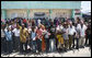 Crowds cheer and wave flags as the motorcade of President George W. Bush and Mrs. Laura Bush arrives Sunday, Feb. 17, 2008, to the Amana District Hospital in Dar es Salaam, Tanzania, where President Bush and Mrs. Bush visited a care and treament clinic. White House photo by Shealah Craighead