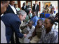 President George W. Bush meets patients and their families Sunday, Feb. 17, 2008, in the reception room of the Amana District Hospital in Dar es Salaam, Tanzania, where President Bush and Mrs. Bush visited a patients and staff at the hospital's care and treament clinic. White House photo by Eric Draper