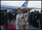 Mrs. Laura Bush and Salma Kikwete, wife of President Jakaya Kikwete of Tanzania, stand on the red carpet Saturday, Feb. 16, 2008, after the arrival of President George W. Bush and Mrs. Bush to Julius Nyerere International Airport in Dar es Salaam. White House photo by Shealah Craighead