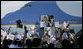 A sea of Tanzania and U.S. flags greets Air Force One as the aircraft carrying President George W. Bush and Mrs. Laura Bush arrives at Julius Nyerere International Airport Saturday, Feb. 16, 2008, in Dar es Salaam. White House photo by Shealah Craighead