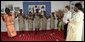 Mrs. Laura Bush and Madame Chantal de Souza Yayi, wife of President Boni Yayi, enjoy a performance by recipients of the Ambassador's Girls Scholarship during a visit Saturday, Feb. 16, 2008, by President George W. Bush and Mrs. Bush to Benin. White House photo by Shealah Craighead