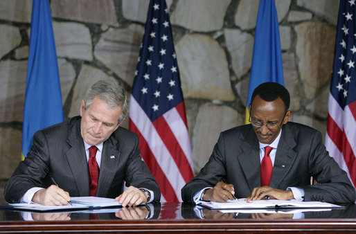 President George W. Bush and Rwanda President Paul Kagame sign a Bilateral Investment Treaty Tuesday, Feb. 19, 2008, at the Presidency in Kigali, Rwanda. White House photo by Chris Greenberg