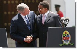 President George W. Bush and President Jakaya Kilwete of Tanzania shake hands following their joint press availability Sunday, Feb. 17, 2008, at the State House in Dar es Salaam, Tanzania. White House photo by Chris Greenberg