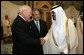 Vice President Dick Cheney, left, shake hands with newly crowned King Abdullah, right, during a retreat at King Abdullah's Farm in Riyadh, Saudi Arabia Friday, August 5, 2005, following the death of his half-brother King Fahd who passed away August 1, 2005. Interperter Gamal Helal, center, is also pictured. White House photo by David Bohrer