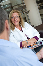 An NCCAM research nurse practitioner talking to a patient about CAM use.